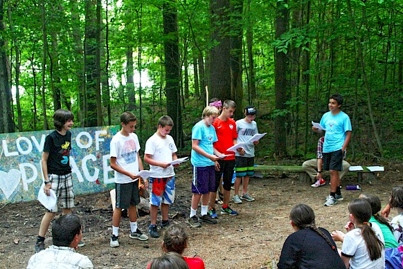 Javier and his boys perform an original skit at camp